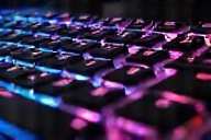 Close-up of a new mechanical keyboard with vibrant RGB lighting